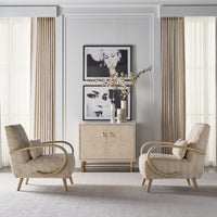 Living room with two chairs and cabinet against wall.