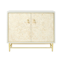 Front view of two-door cabinet with gold accents.