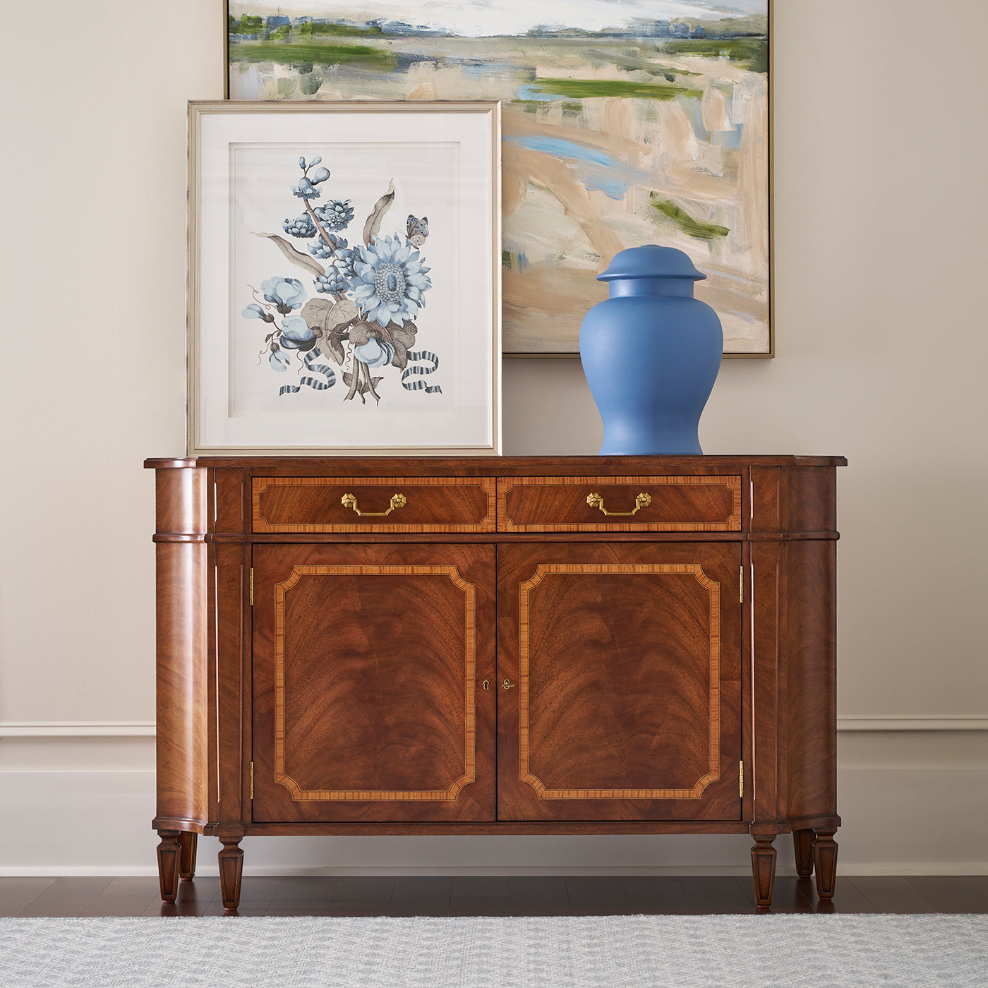 Sideboard with decorative items, room setting.