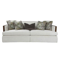 Front view of Callisto sofa, floral and solid pillows.