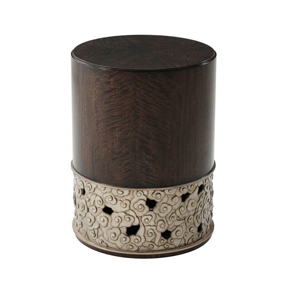 Dark wood cylindrical accent table, bottom detail.