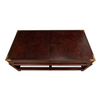Top view, leather coffee table with brass corners.