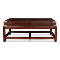 Leather coffee table, front view with brass accents.