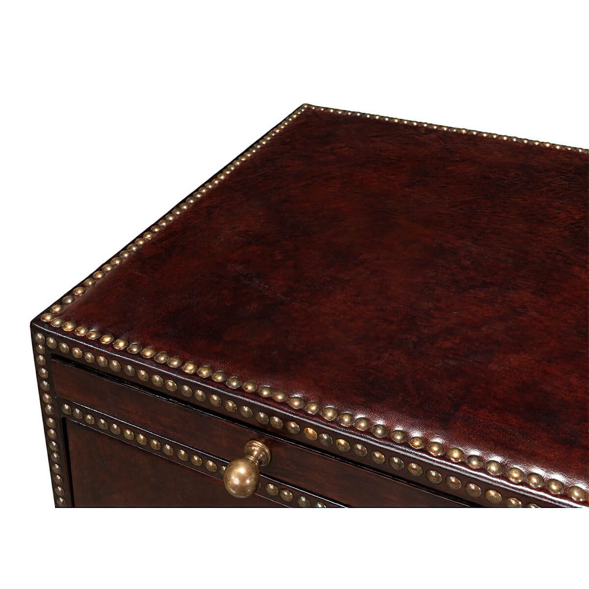 Close-up of top surface, brown campaign dresser, decorative trim.