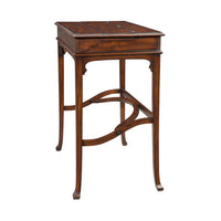 Side view of campaign style desk, detailed leg design.