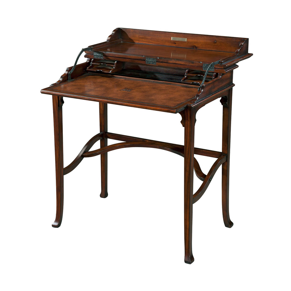Antique campaign style desk open with writing surface.