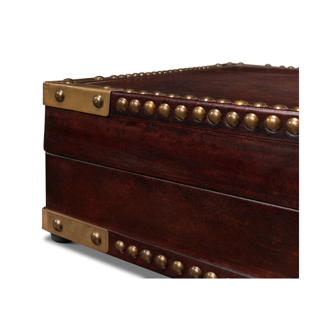 Close-up of campaign style leather box corner edge.