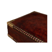 Close-up of campaign style leather box corner details.