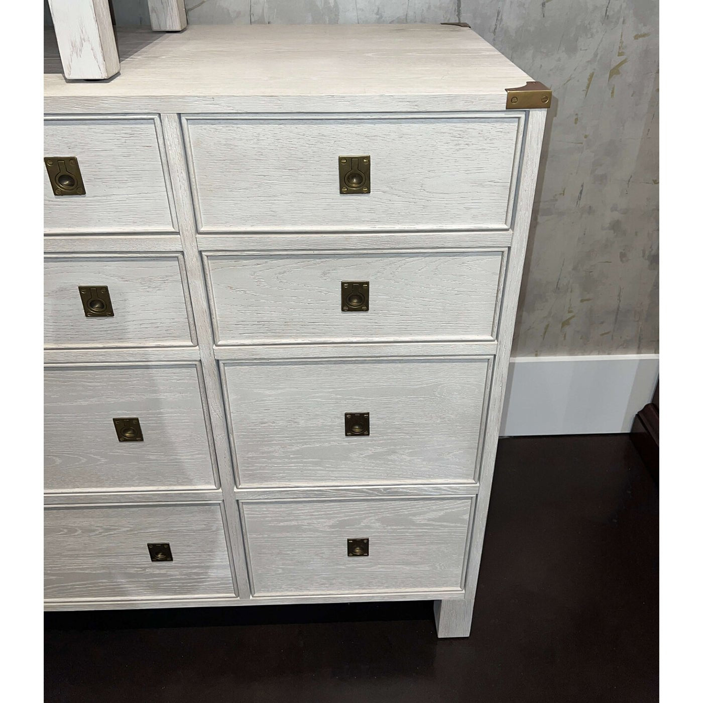 Close-up of dresser drawers, white oak texture, brass accents.