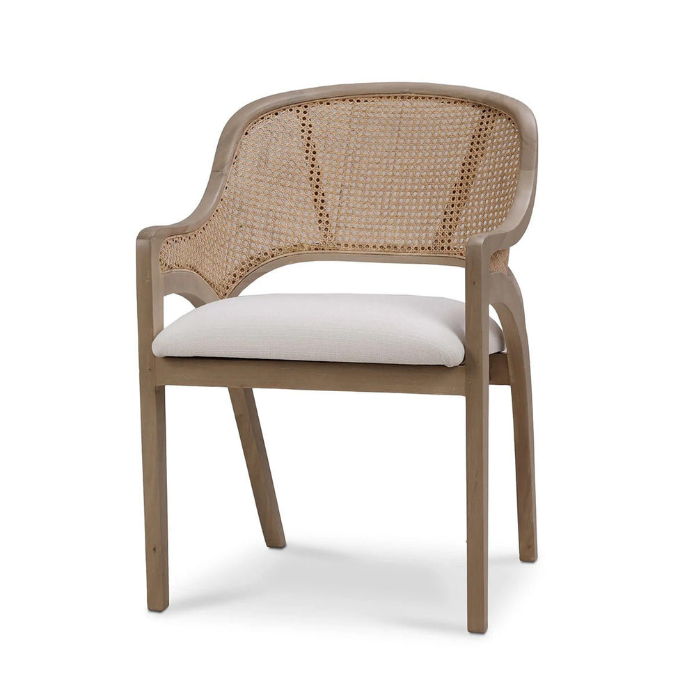 Mid-century dining chair with caned back and cushion.