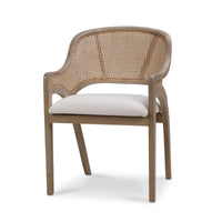 Mid-century dining chair with caned back and cushion.