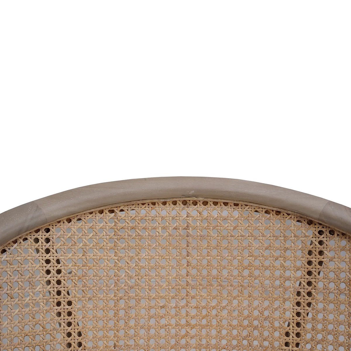 Close-up of caned back detailing on chair.