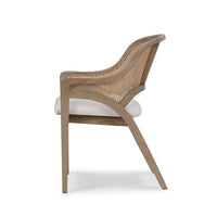 Side profile of caned back dining chair.