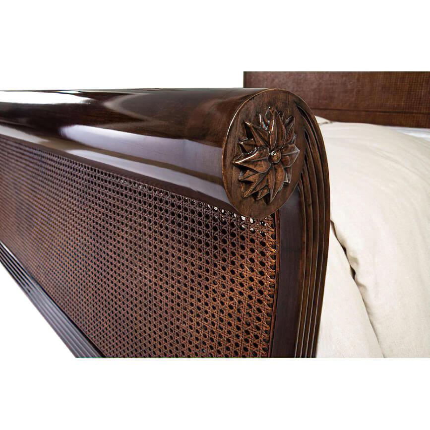 Close-up of sleigh bed cane and carved detail.