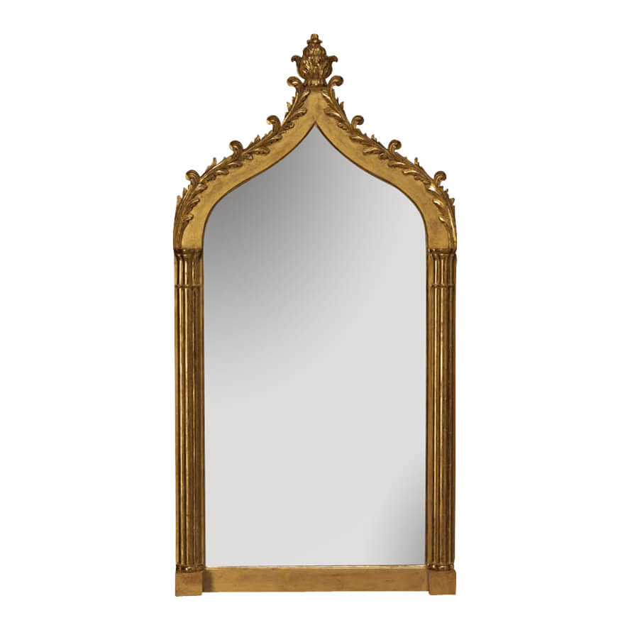 Decorative carved giltwood gothic mirror with intricate detailing.