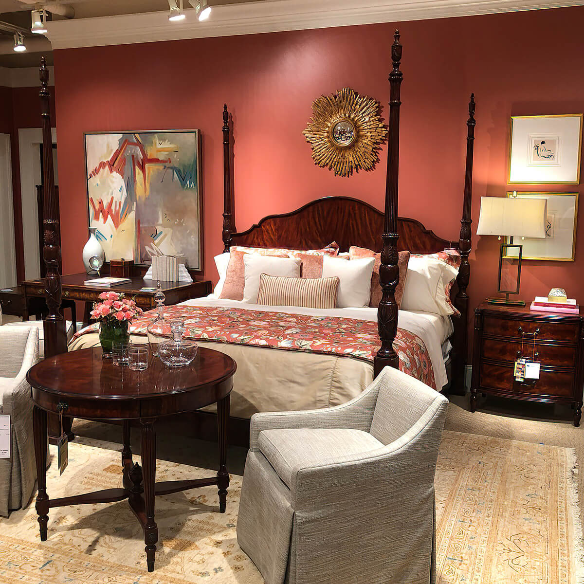 Four post bed styled in warm-toned room.