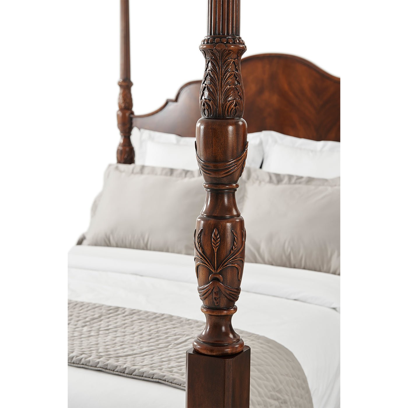 Detailed carving on mahogany bedpost.