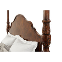 Close-up of headboard and carved post details.