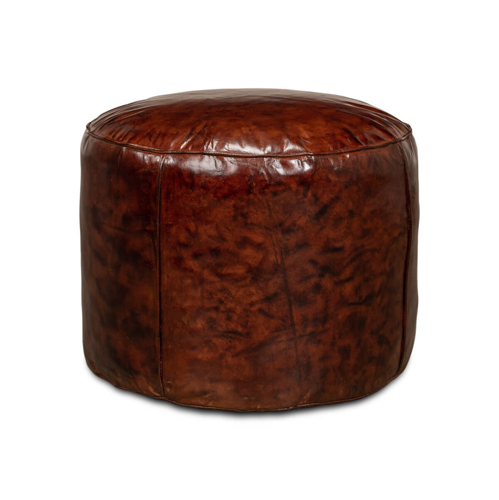 Brown leather round stool front view, polished finish.