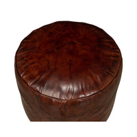 Overhead view of brown leather round stool.