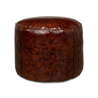 Side angle of leather stool, rich brown texture.