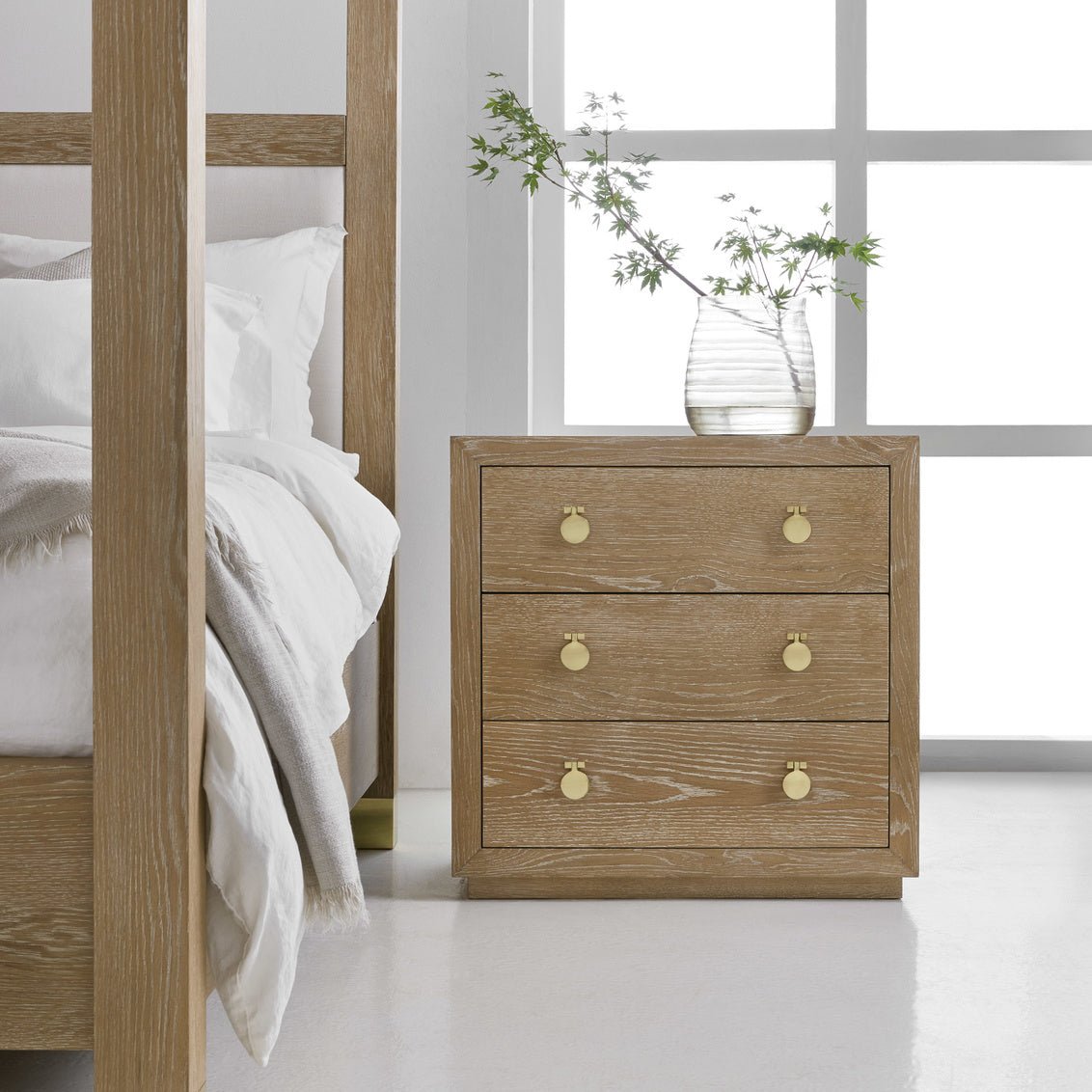 Cerused oak bedside chest in bedroom setting with decor.