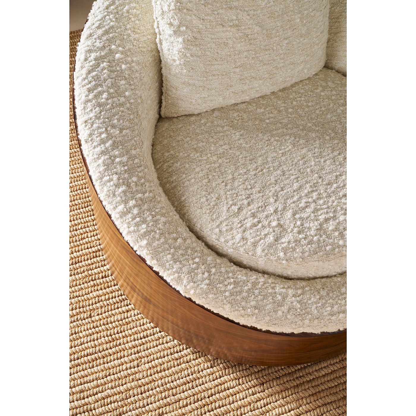 Close-up of lounge chair cushion, wood detail.