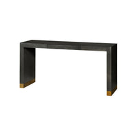 Black console table with gold accents, studio background.