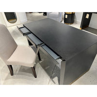 Open charcoal desk drawers showcasing interior compartments.