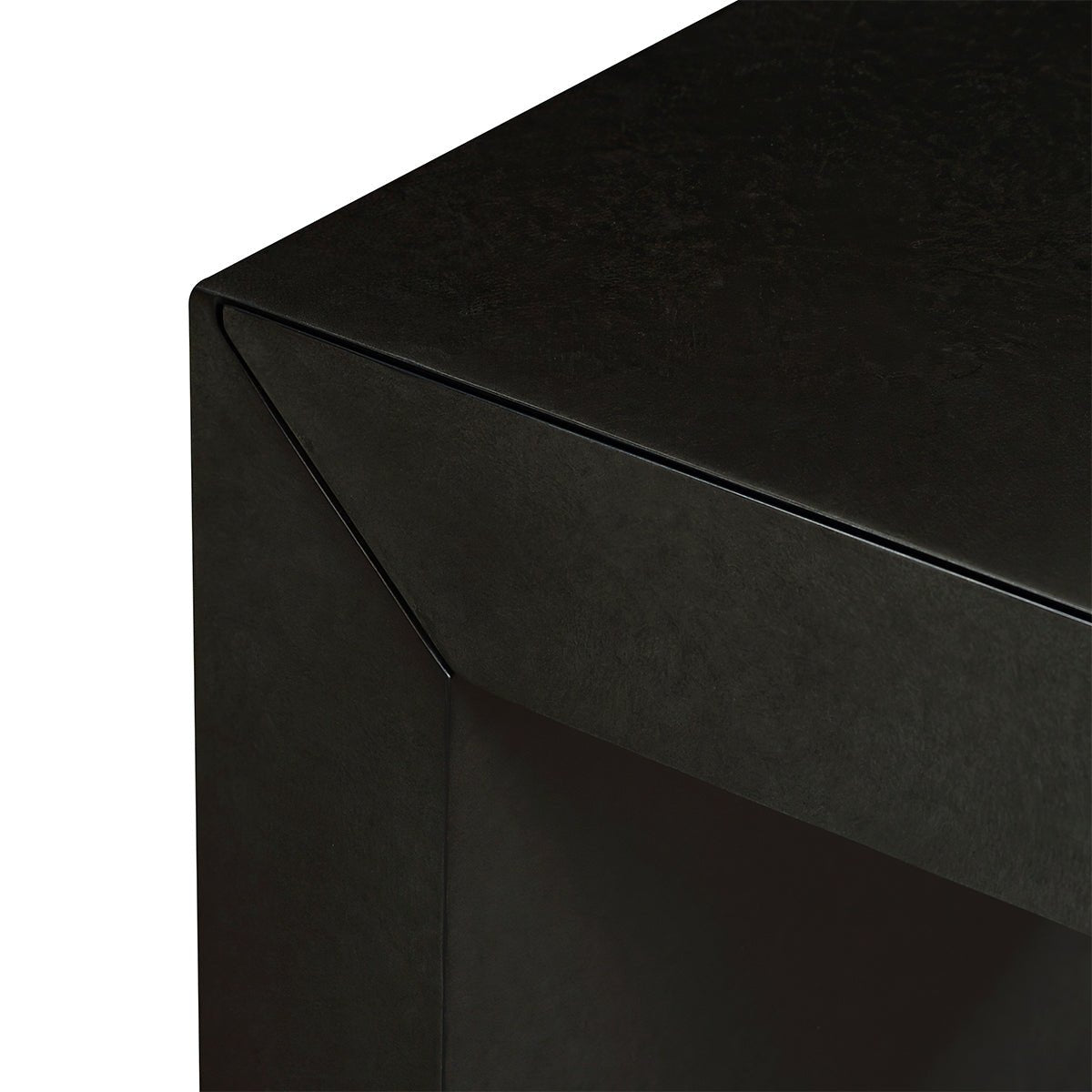 Close-up of charcoal desk corner detailing.