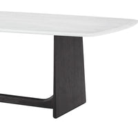 Close-up of dining table corner and base.