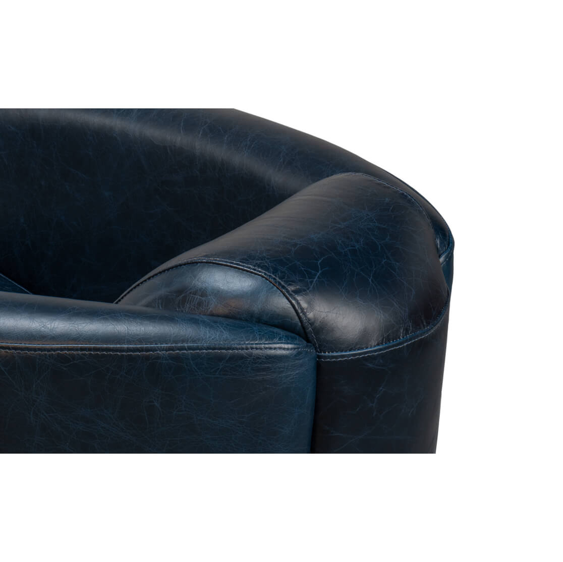 Close-up, armrest detail on club chair.
