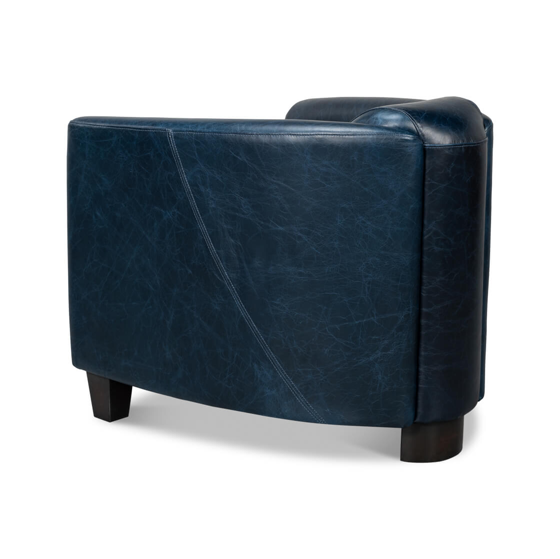 Blue leather club chair, angled side view.