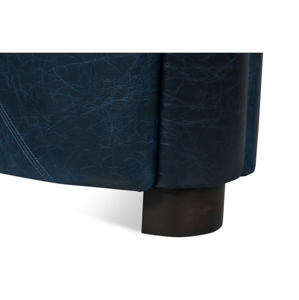 Close-up, back leg detail on club chair.