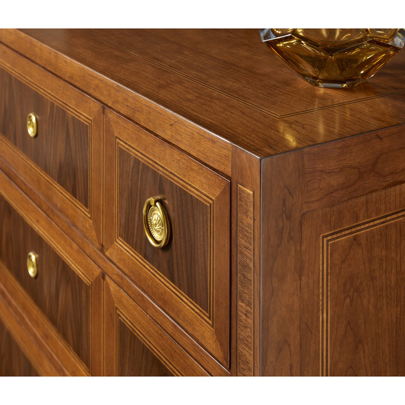 Close-up of wood grain on chest of drawers.