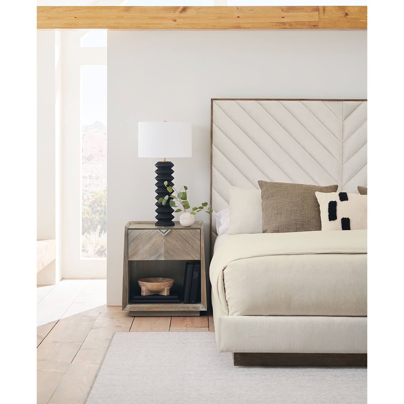 Close-up side view of Chevron Tufted King Bed.