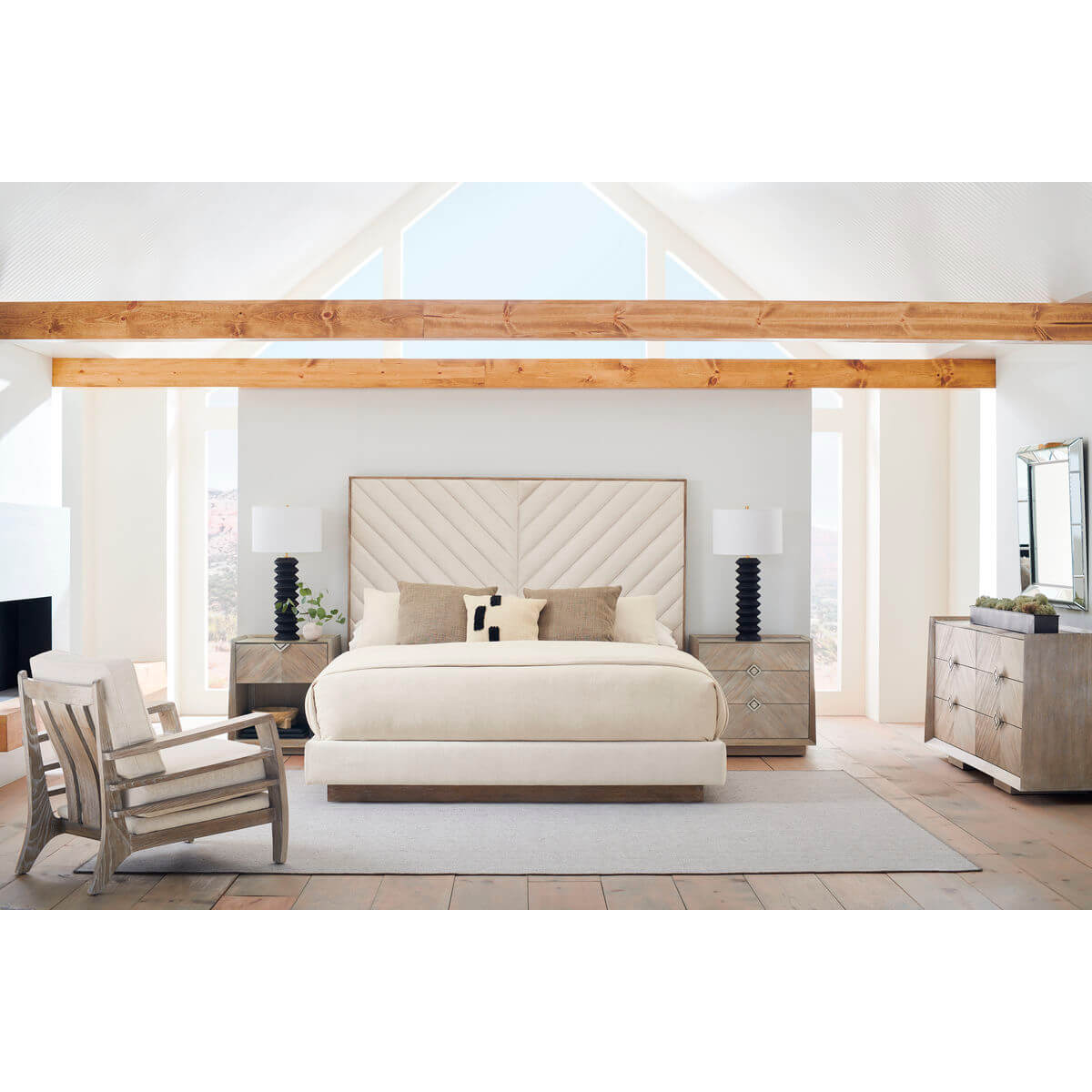 Bedroom layout featuring chevron tufted upholstered queen bed.