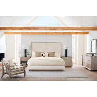 Bedroom layout featuring chevron tufted upholstered queen bed.
