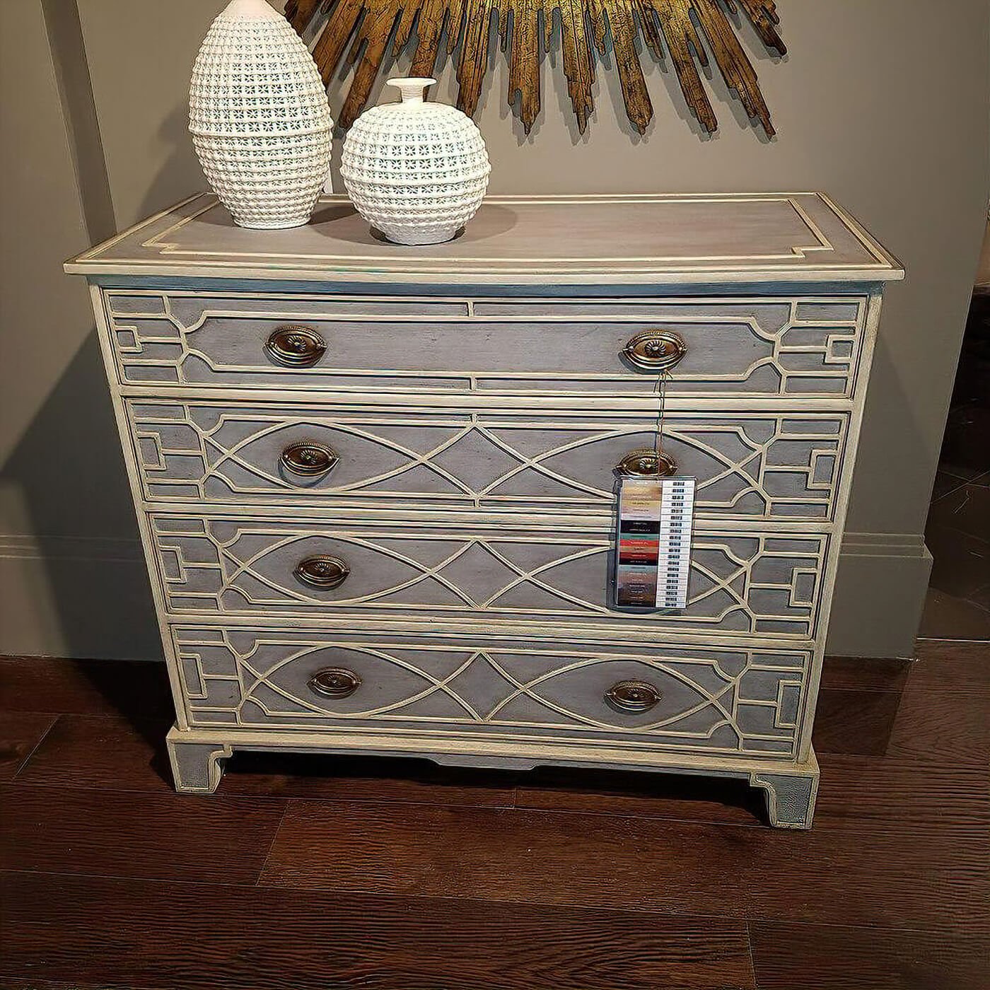 Chinese Chippendale painted chest styled with decorative vases.