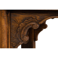 Focus on carved detail in console table leg design.