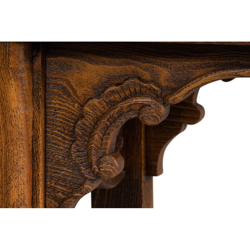 Focus on carved detail in console table leg design.