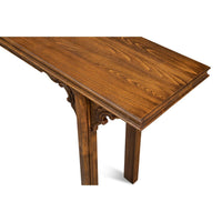 Close-up of wood texture on console table surface.