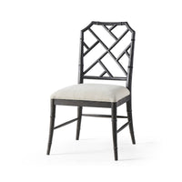 Black bamboo dining chair with geometric back design.