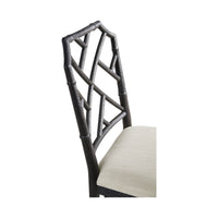 Close-up of ebonized bamboo chair back detail.