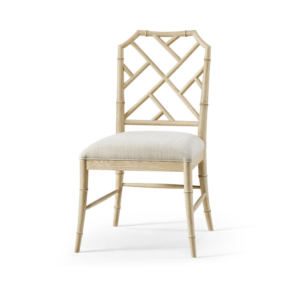 Side view of Chippendale bamboo dining chair, light oak.