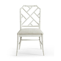 White Chippendale bamboo dining chair front view.