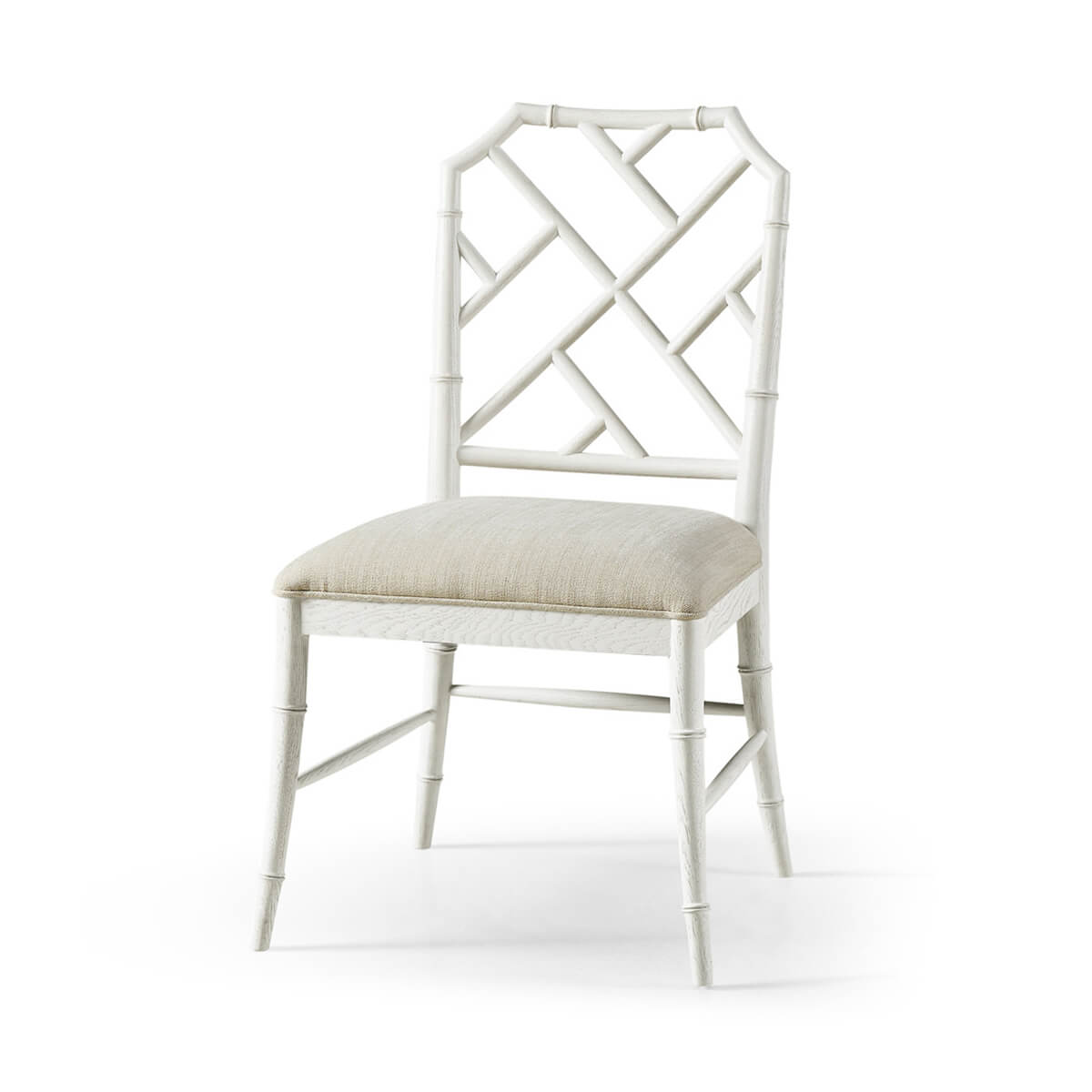 White Chippendale bamboo dining chair angled front view.