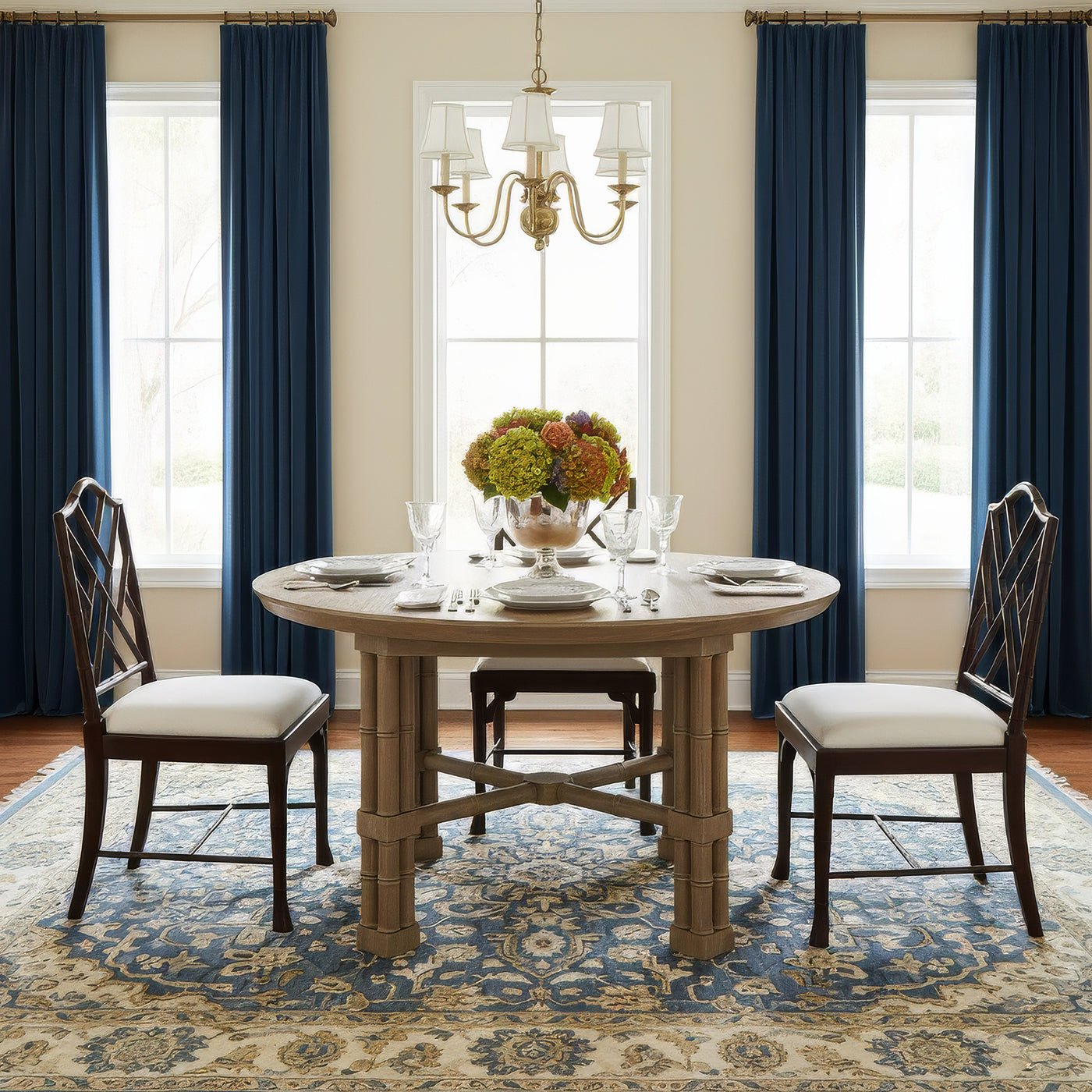 Dining room with Chippendale chairs around table.