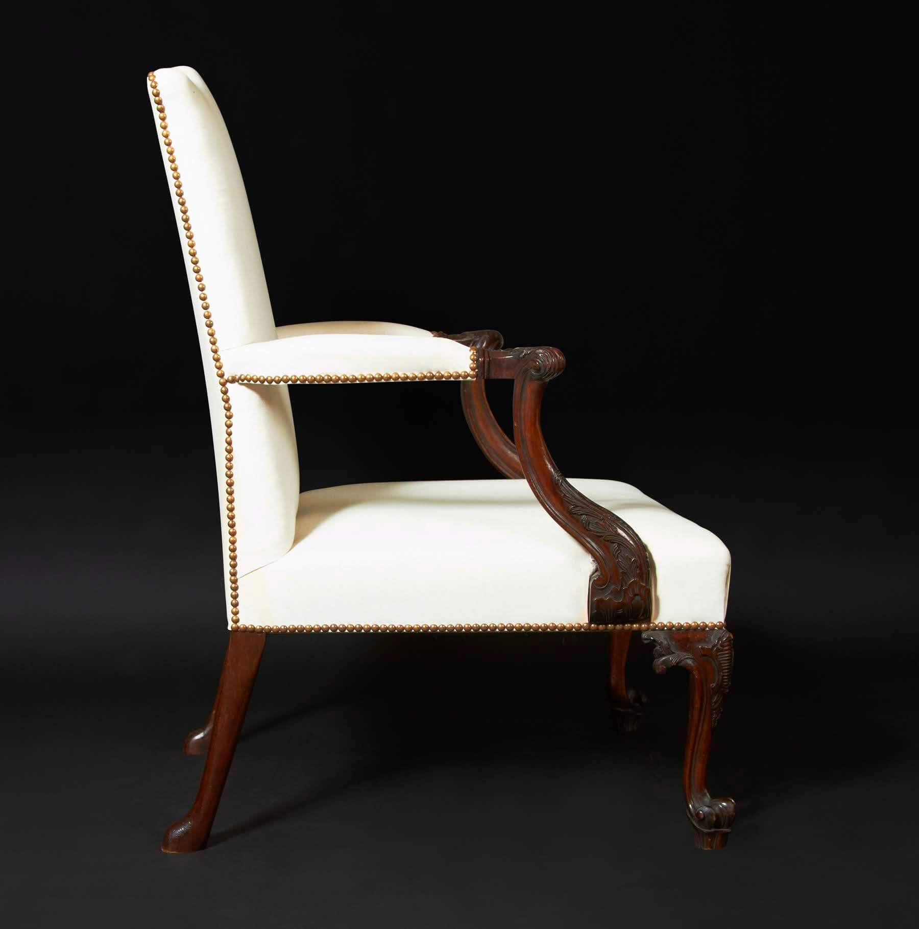 Side profile of white Chippendale Gainsborough armchair.