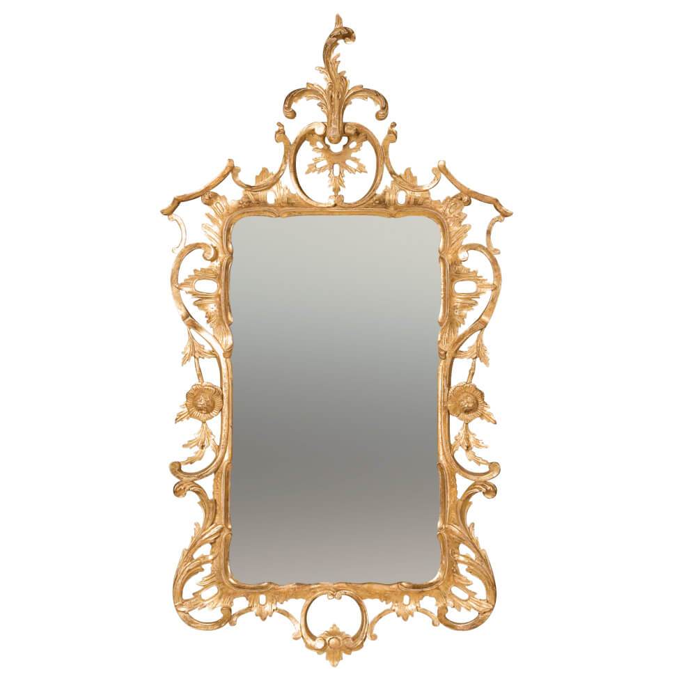Ornate Chippendale giltwood mirror with intricate carvings.